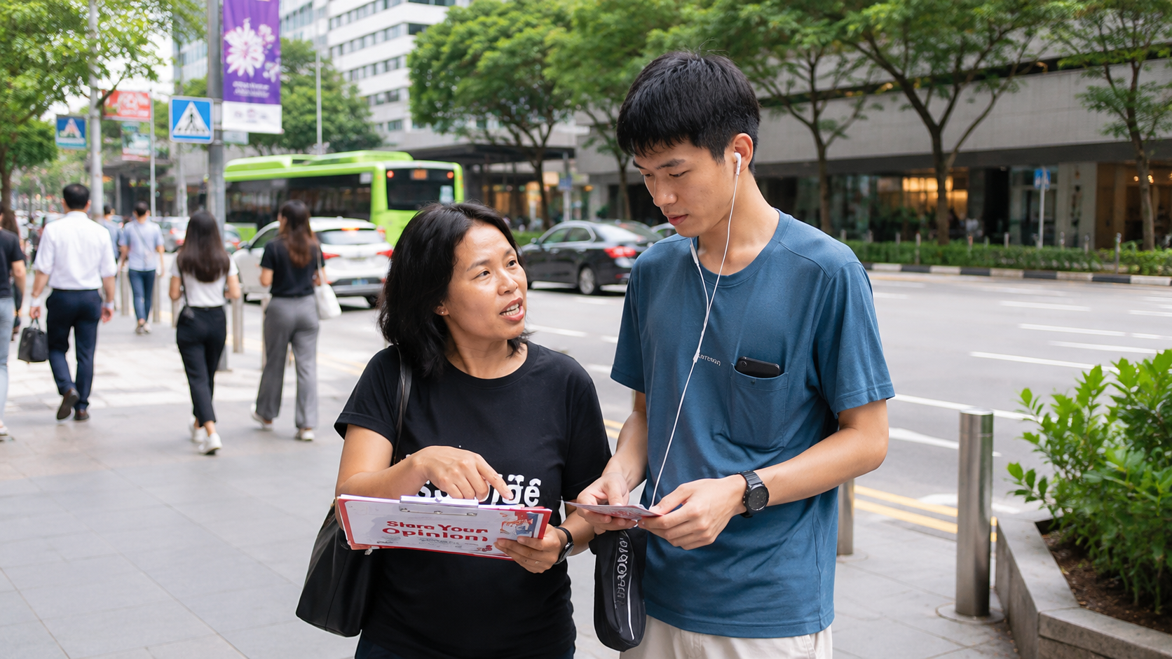 High foot traffic pedestrian crossing in Singapore during peak hours, suitable for flyer distribution jobs and street marketing